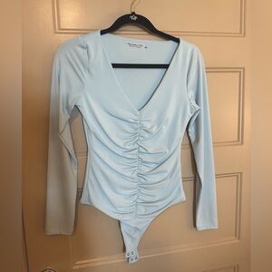 Abercrombie and Fitch Light Blue Long Sleeve Ruched Bodysuit size small.
